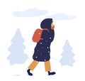 Young woman in warm seasonal outwear walking in winter park. Female character in long down jacket with a backpack