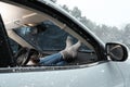 Young woman in warm socks resting inside car Royalty Free Stock Photo