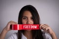 Young woman was wrapping her mount by adhesive tape, Concept freedom of speech, censorship, freedom of press. International Human Royalty Free Stock Photo