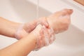 Young woman washes her hands thoroughly. Hygienic hand washing Royalty Free Stock Photo