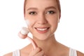 Young woman washing face with brush and cleansing foam on background. Cosmetic products Royalty Free Stock Photo