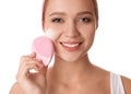 Young woman washing face with brush and cleansing foam on background. Cosmetic products Royalty Free Stock Photo