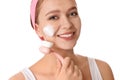 Young woman washing face with brush and cleansing foam on background. Cosmetic products Royalty Free Stock Photo