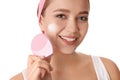 Young woman washing face with brush and cleansing foam on background. Cosmetic products Royalty Free Stock Photo