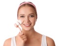 Young woman washing face with brush and cleansing foam on background. Cosmetic products Royalty Free Stock Photo