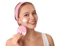 Young woman washing face with brush and cleansing foam on background. Cosmetic products Royalty Free Stock Photo