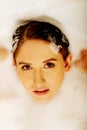Young woman washing hair in bath Royalty Free Stock Photo