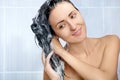 Young woman washing head by shampoo Royalty Free Stock Photo