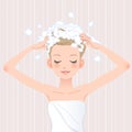 Young woman washing her head with shampoo