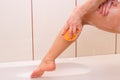 Young woman washing with sponge in the bath Royalty Free Stock Photo