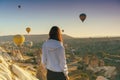 Young Woman Watching Ballooning Festival At Sunrise Royalty Free Stock Photo