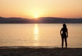 Young woman watching sunset