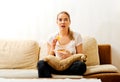 Young woman watching TV and eating chips Royalty Free Stock Photo