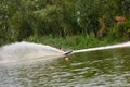 Young woman waterskiing