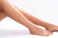 Young woman waxing her lower leg Royalty Free Stock Photo