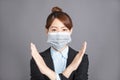 Young woman  wear medical mask and showing no and stop sign gesture. keep away, Social distance Royalty Free Stock Photo