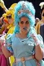 Young woman wearing an aqua dress with matching hair and lipstick and a tiara at the Fifth Avenue Easter Parade