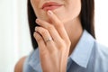 Young woman wearing beautiful engagement ring