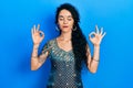 Young woman wearing bindi and traditional kurta dress relax and smiling with eyes closed doing meditation gesture with fingers Royalty Free Stock Photo