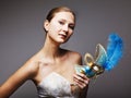 Young woman wearing blue carnival mask Royalty Free Stock Photo