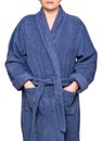 Young woman wearing blue cotton velour bathrobe