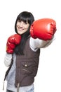 Young woman wearing boxing gloves smiling Royalty Free Stock Photo