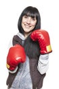 Young woman wearing boxing gloves smiling Royalty Free Stock Photo