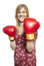 Young woman wearing boxing gloves smiling Royalty Free Stock Photo