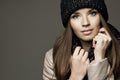 Young woman wearing cap smiling on light background. studio shot Royalty Free Stock Photo