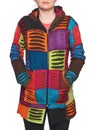 Young woman wearing coat of many colors hooded long patchwork jacket