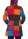 Young woman wearing coat of many colors hooded long patchwork jacket