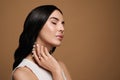 Young woman wearing elegant pearl jewelry on brown background, space for text Royalty Free Stock Photo