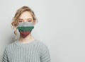 Young woman wearing a face mask with national flag Bulgaria flag. Flu epidemic and virus protection concept Royalty Free Stock Photo