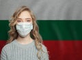 Young woman wearing a face mask with national flag Bulgaria. Flu epidemic and virus protection concept Royalty Free Stock Photo