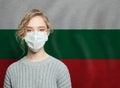 Young woman wearing a face mask with national flag Bulgaria. Flu epidemic and virus protection concept