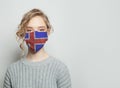 Young woman wearing a face mask with national flag Iceland. Flu epidemic and virus protection concept