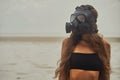 Young woman is wearing a gas mask Royalty Free Stock Photo