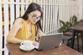 Young woman looking her laptop in cafe Royalty Free Stock Photo