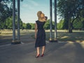 Young woman wearing hat at bandstand in park Royalty Free Stock Photo
