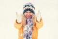 Young Woman wearing hat and scarf happy smiling playing with snow outdoor Royalty Free Stock Photo