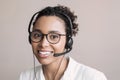 Young woman wearing headset. Portrait of customer service assistant talking on phone Royalty Free Stock Photo