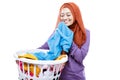 Young woman wearing hijab carrying laundry basket while smelling Royalty Free Stock Photo