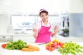 Young woman wearing kitchen apron with tablet Royalty Free Stock Photo