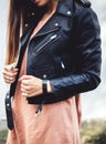 Young woman wearing leather jacket, man, fashion, style Royalty Free Stock Photo