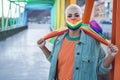 Young woman wearing LGBT rainbow flag during coronavirus outbreak - Focus on face