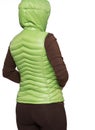 Young woman wearing light green hooded packable down puffer vest