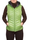 Young woman wearing light green hooded packable down puffer vest