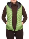 Young woman wearing light green hooded packable down puffer vest