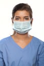 Young Woman Wearing Medical Scrubs and a Surgical Mask Royalty Free Stock Photo