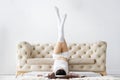 Young woman wearing pajamas listening to music in interior light room Royalty Free Stock Photo